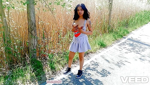 Busty lady is showing her tight asshole while riding a bike