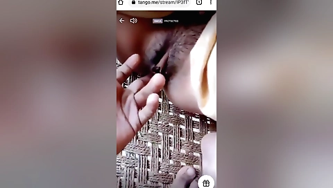 Sexy brunette girl is fingering the guy's cock and licking it