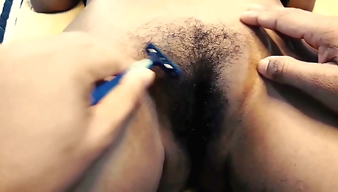 Indian girl is rubbing her hairy pussy and fingering