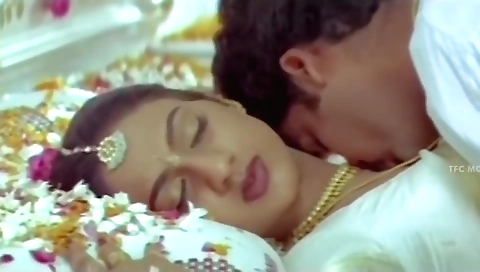 Busty brunette plays with her young husband and his big cock