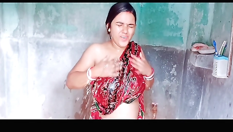 Hot brunette in a white dress showing off her boobs in shower