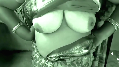 Indian girl with huge tits moves around and shows us