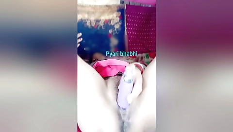 Indian girl has a hairy pussy and a dildo in her vagina