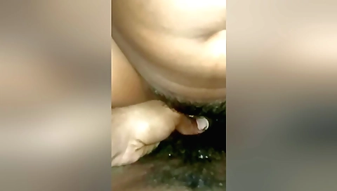 Indian girl in stockings plays with her hairy pussy