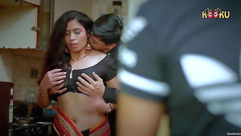 Blonde brunette in red stockings and pink blouse is drinking