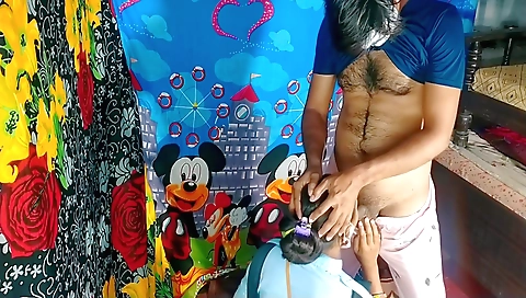 Redheaded slut in a red dress gets a handjob from the student