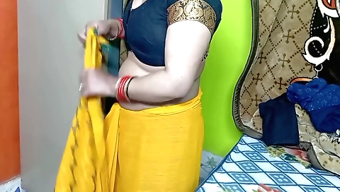 Indian beauties in her yellow color sari enjoys solo sex