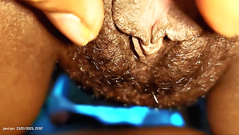 Indian hairy pussy closeup with a little white condom