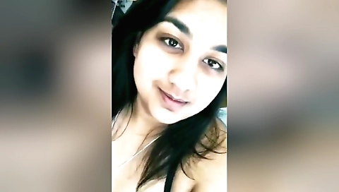 Sexy brunette in lingerie shows her tits on webcam