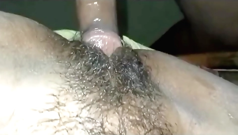 Indian babe with a hairy pussy gives blowjob to her man