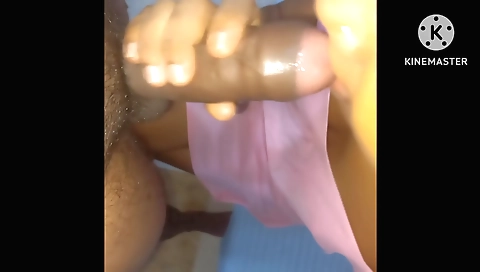 Indian teen in pink dress gives her face a sensual face