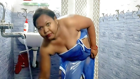 Indian housewife wearing a white towel in the shower