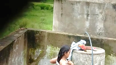 Indian Village Girl Bathing Near Water Tank Outdoor