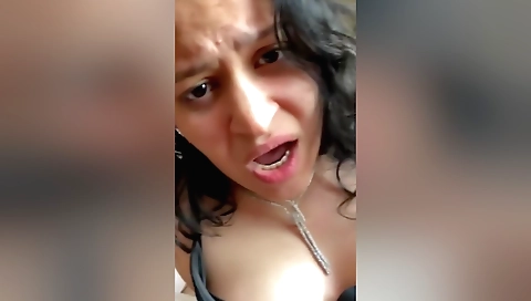 Brunette amateur with a sexy face getting fingered in a vid