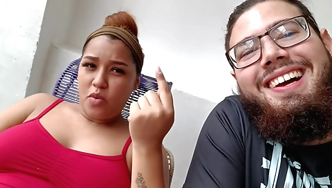 Busty brunette is on her bed in an amateur porn video