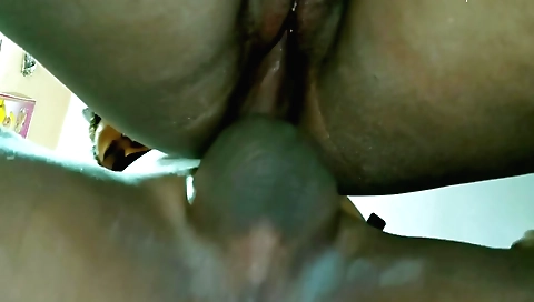 A brunette in a pink top and black dress enjoys a doggy style fuck