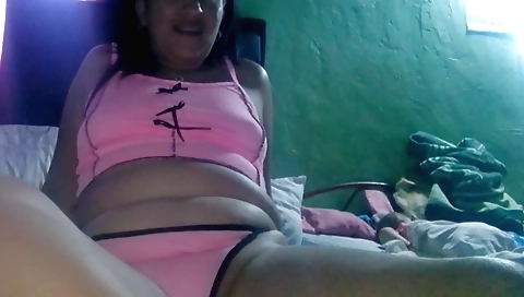 Indian brunette is masturbating in the bedroom in her bed