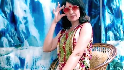 Indian girl in white dress plays with hair and takes off her clothes