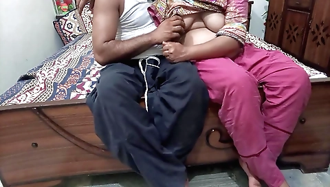 A hot brunette 18+ slut is putting a cucumber in her pussy