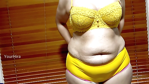 Indian babe stretches naked and shows off her body