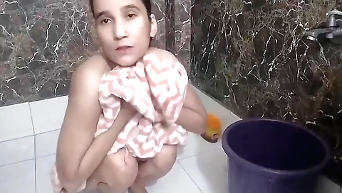 Indian girl in a white dress masturbating in bathroom