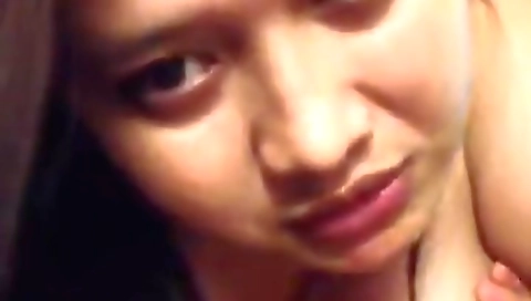 Brunette amateur babe with big tits is showing off