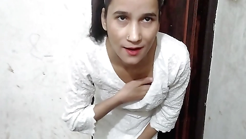 Indian college girl in black blouse and white skirt in bathroom