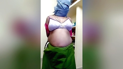 Indian babe in a red dress shows off her big boobs