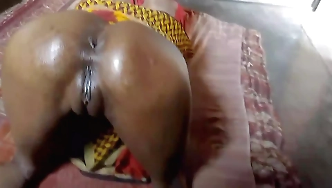 Indian brunette is getting her oil on her face and ass