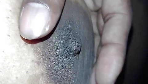 A beautiful brunette in lingerie shows off her tits