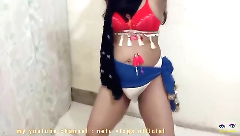 Indian hairdancer in a sexy dress takes off her clothes