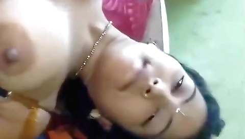 Indian brunette with a big boobed pussy is alone in the bedroom